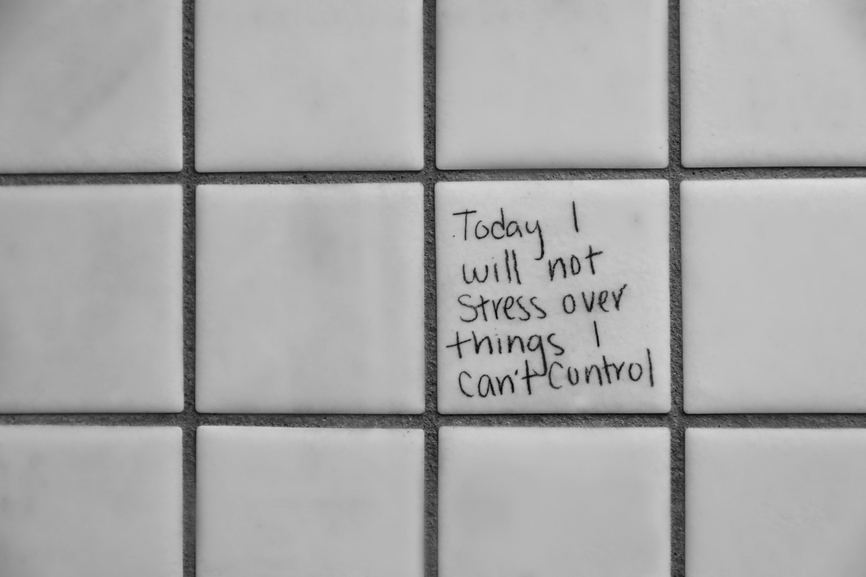 Graffiti on a wall which reads: "Today I will not stress over things I can't control."
